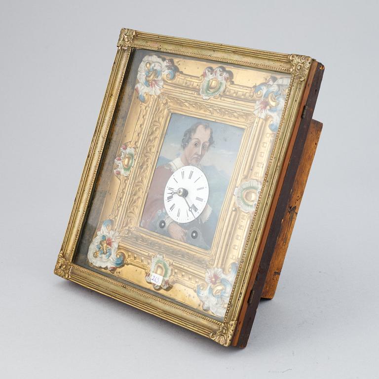 A Schwarzwald area wall pendulum clock with mechanical eye-movment, mid 19thcentury.