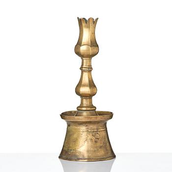 An Ottoman brass 'Tulip' Candelstick, Turkey, 17th/18th century.