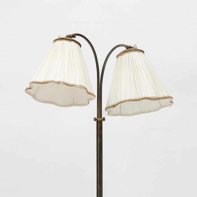 A brass floor lamp, mid 20th Century.