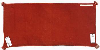 An embroidered Carriage cushion, c 102 x 48 cm Wemmenhög district, southern Skåne, first quarter of the 19th century.