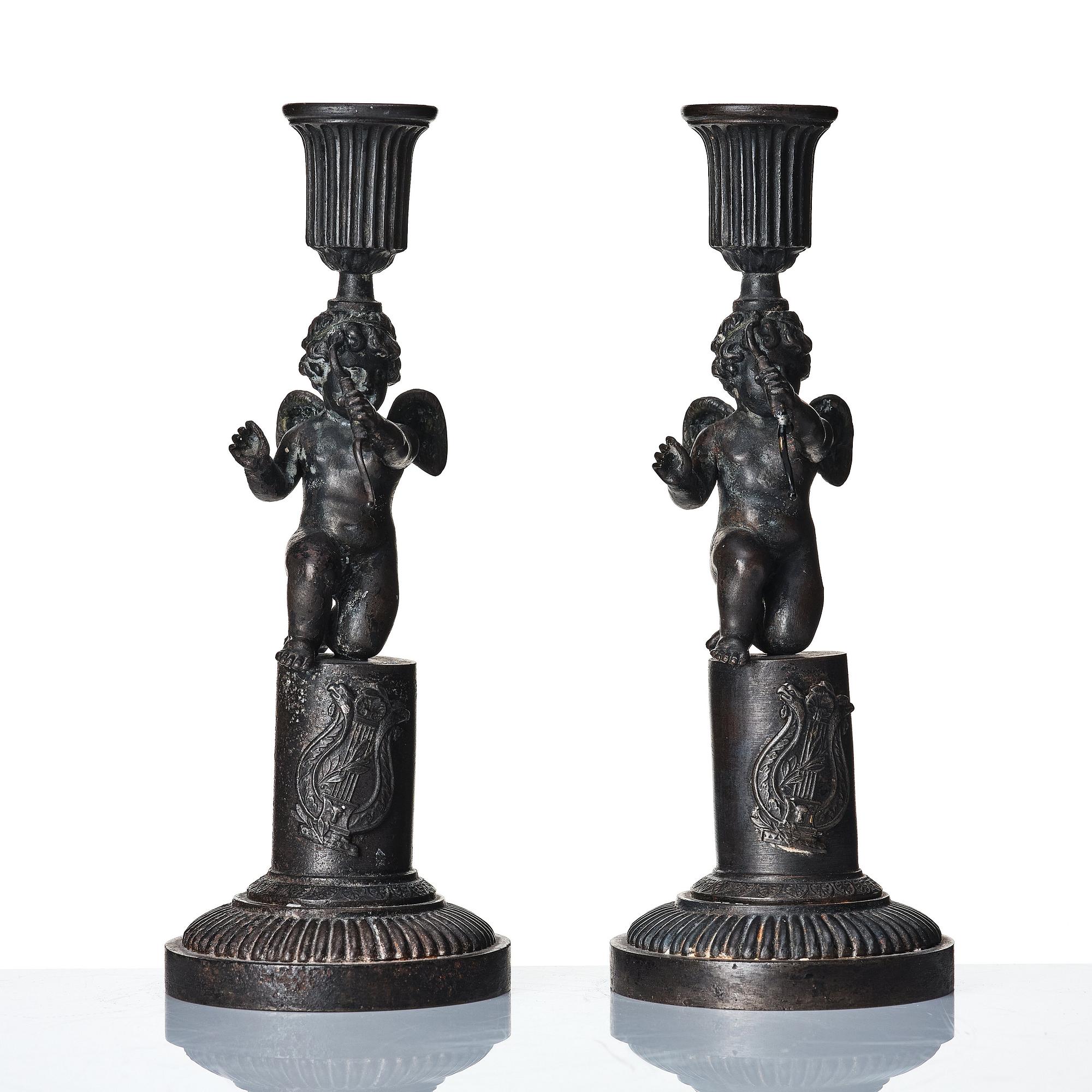 A pair of German (Berliner Eisen) Empire iron candle sticks.