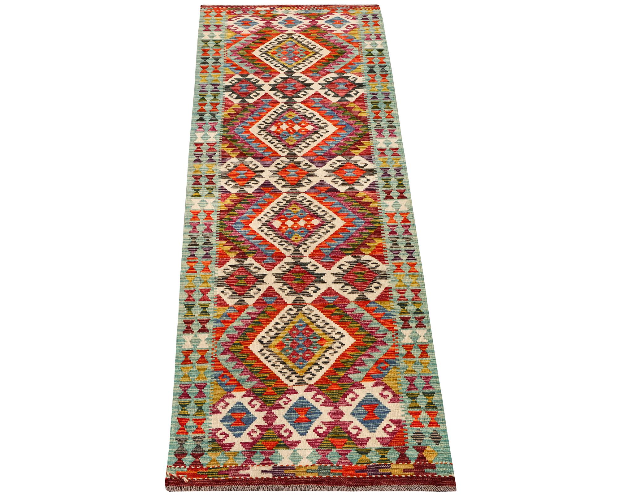 An Afghan kilim runner, c. 294 x 82 cm.
