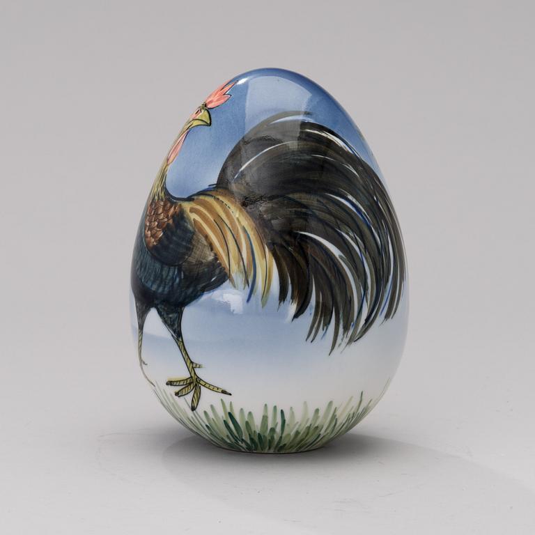 A porcelain egg signed GOG Arabia Finland.