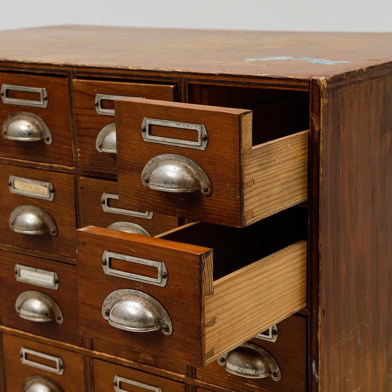 A pine cabinet with drawers, first half of the 20th Century.