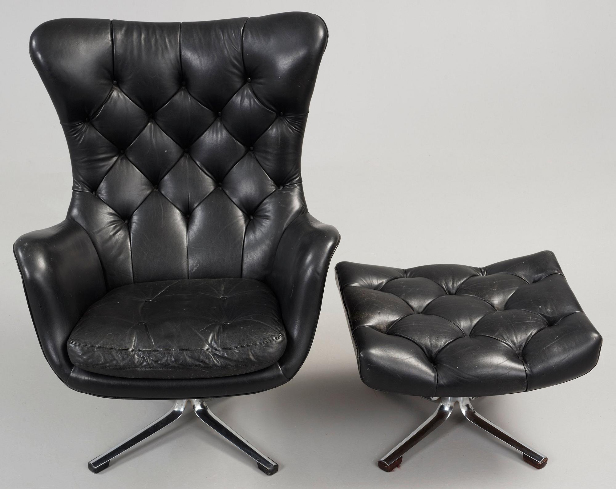 A Gustav Axel Berg 'Status' black leather easy chair with ottoman, Bröderna Andersson 1960's-70's.