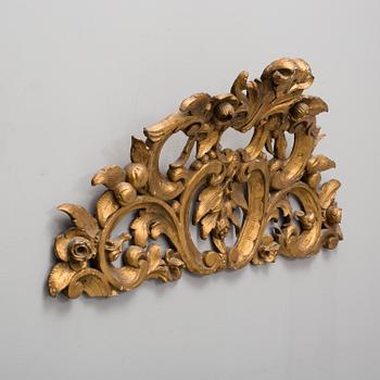 A late 19th century gilt rokoko style carved wooden ornament.