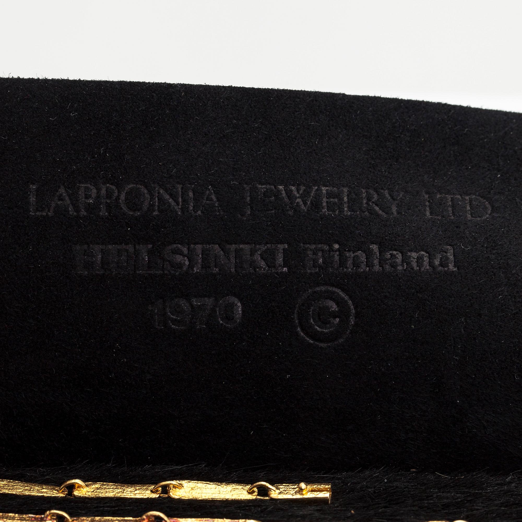 Björn Weckström, Kaulakoru "Kukkiva muuri", 18K kultaa ja turmaliineja. Lapponia 1974.