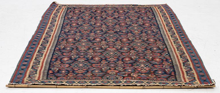An antique Senneh kilim, West Persia, c. 149 x 11 cm.