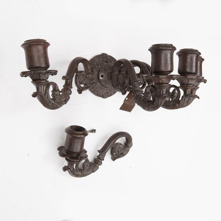 An early 20th century cast iron vall sconce candleholder for five candles.