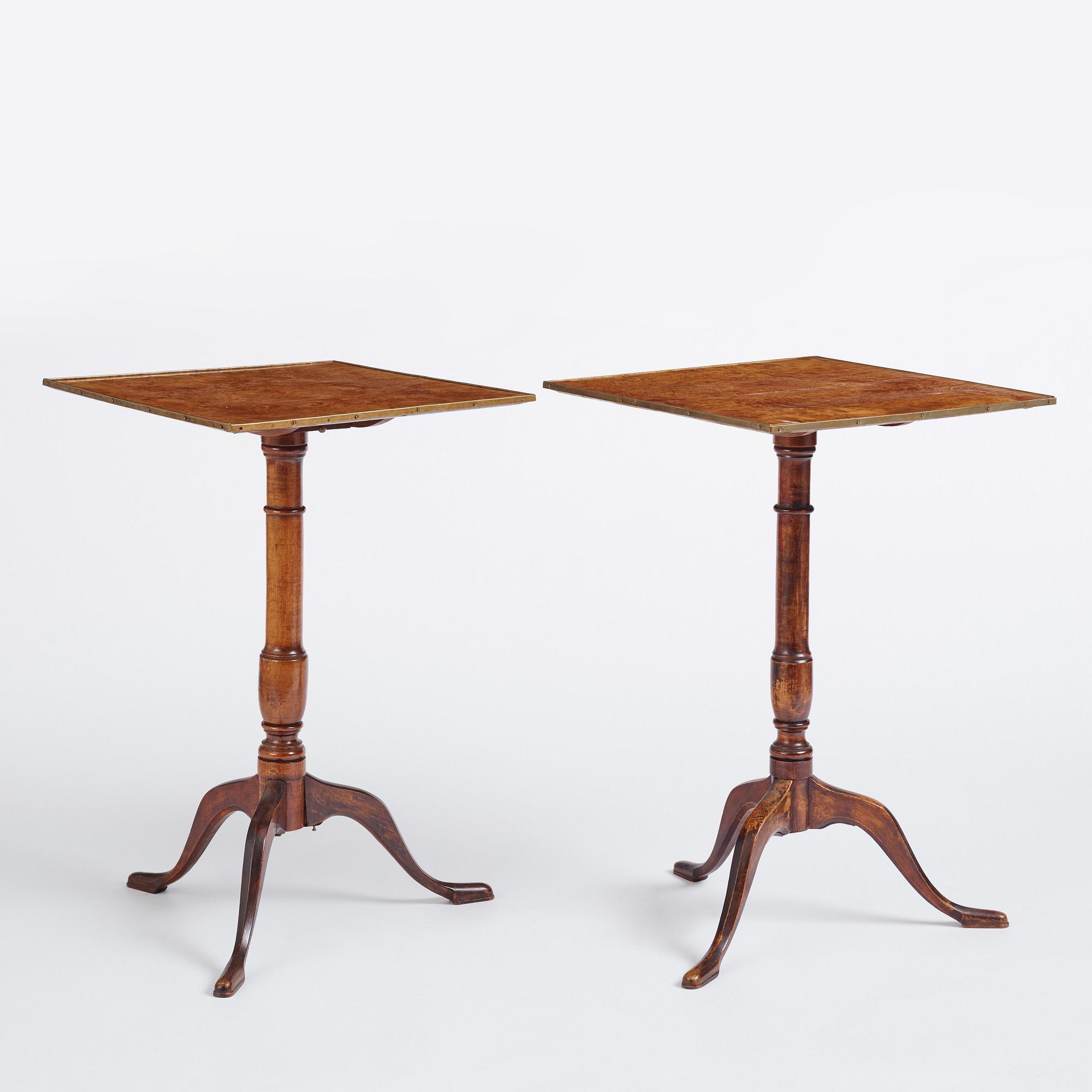 A pair of alder-veneered tilt-top tables by C. Hollst (master 1787-1830).