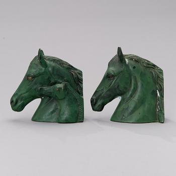 A pair of bronze bookends from the second half of the 20th century.