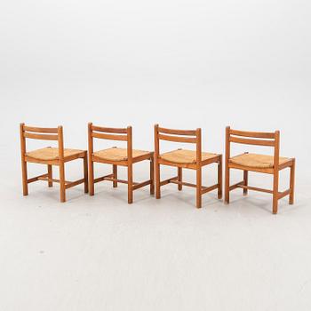 A set of four 1970s pine chairs.