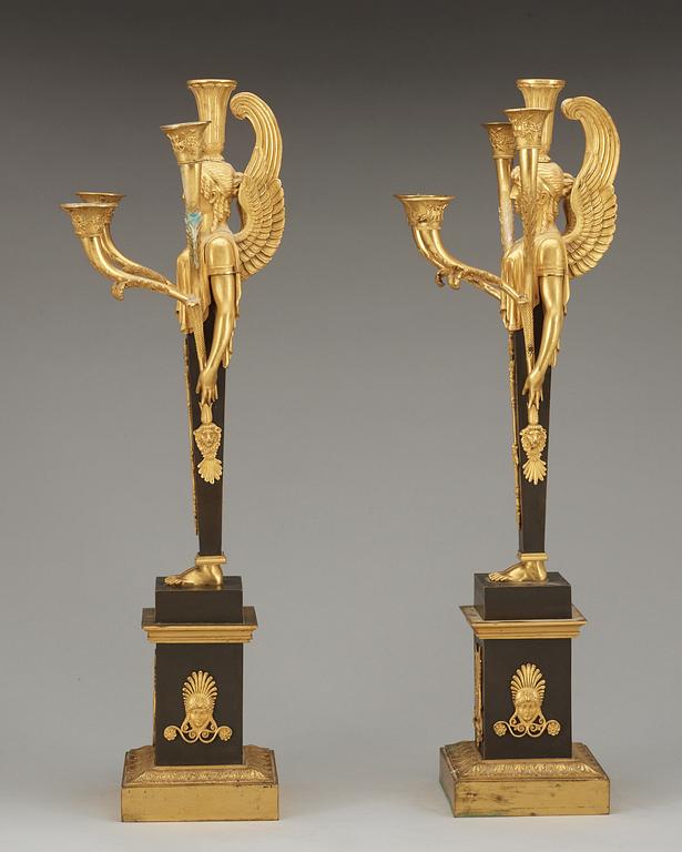 A pair of French Empire early 19th Century five-light candelabra.