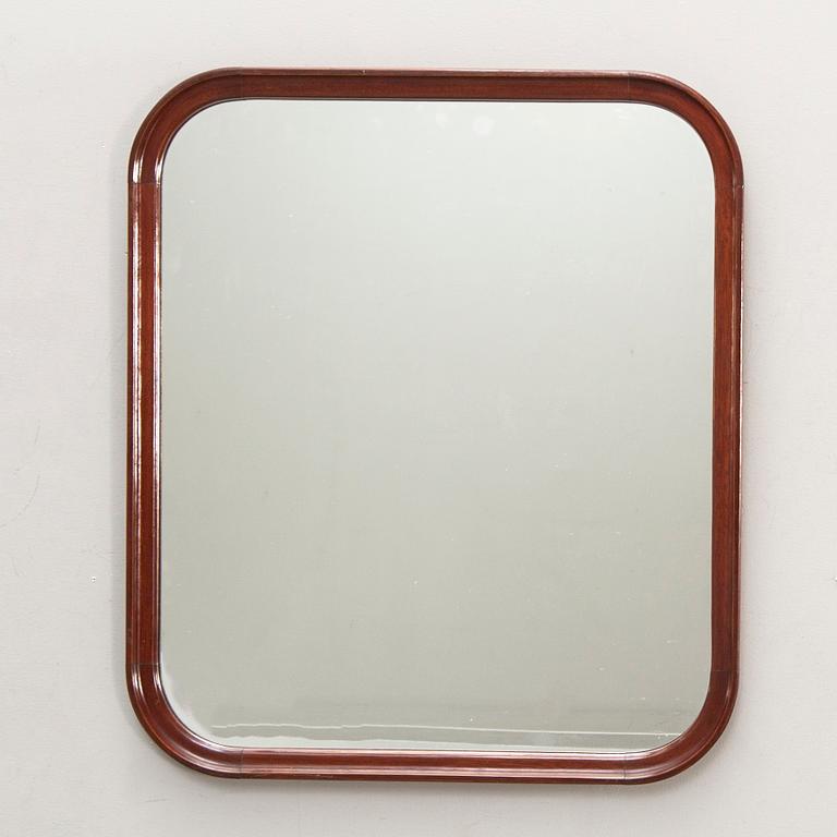 A Swedish mahogany mid 1900s mirror.