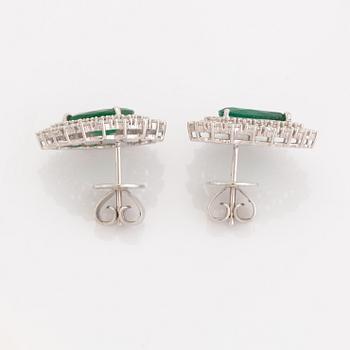 Pear shaped emeralds and brilliant cut diamond earrings.