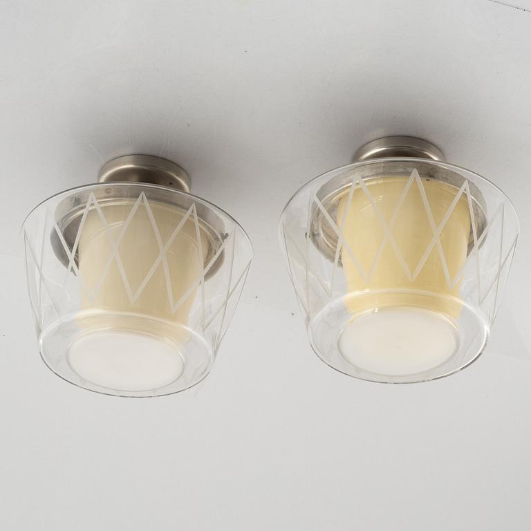 Harald Notini, taklampor, ett par, modell "11197", Arvid Böhlmarks Lampfabrik, Stockholm, 1940-50-tal.