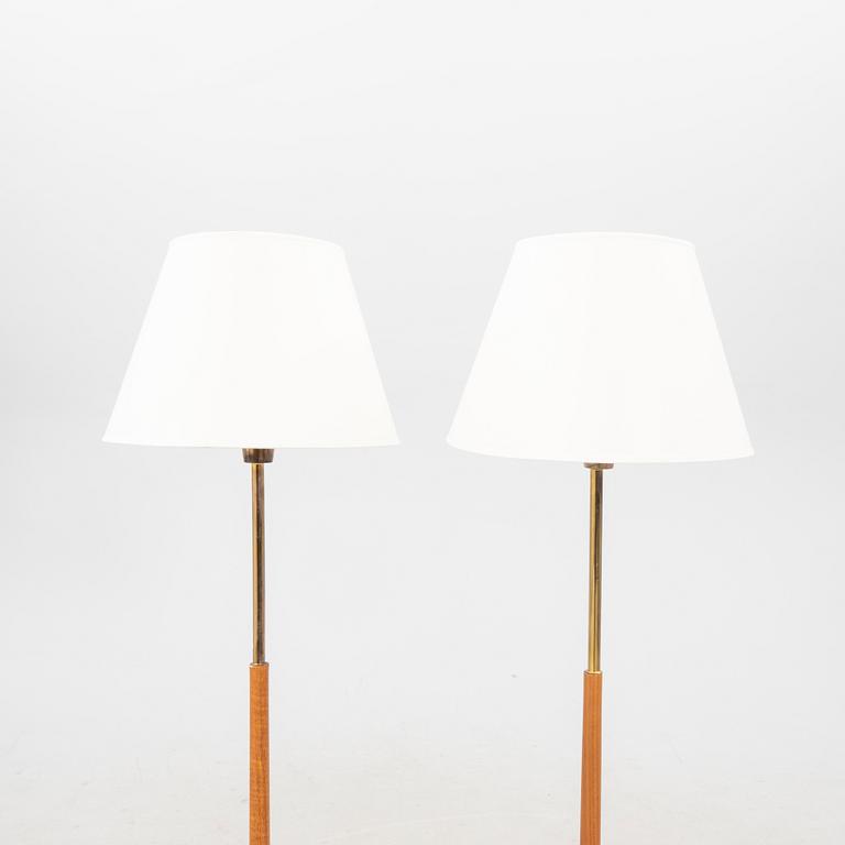 A pair of 1960s teak floor lamps.