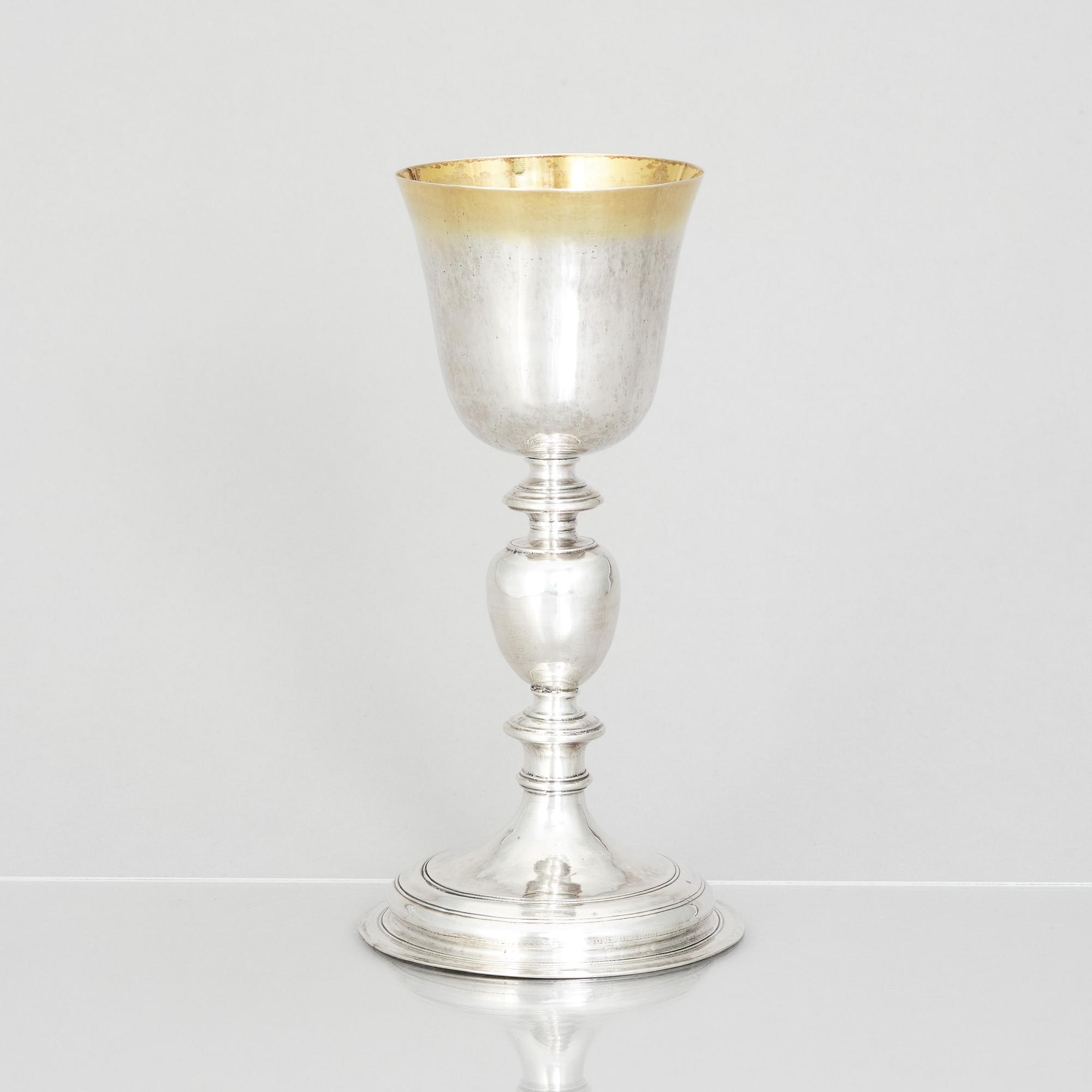 An 18th century parcel-gilt silver cup, makers mark A.M, probably Germany.
