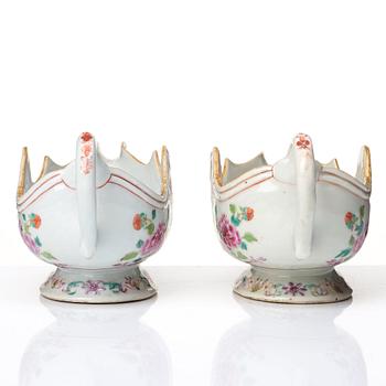 A pair of famille rose 'double peacock sauce boats, Qing dynasty, Qianlong (1736-95).