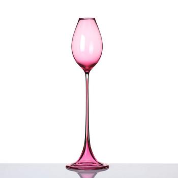 Nils Landberg, a cerise tinted glass goblet, Orrefors Sweden 1957.