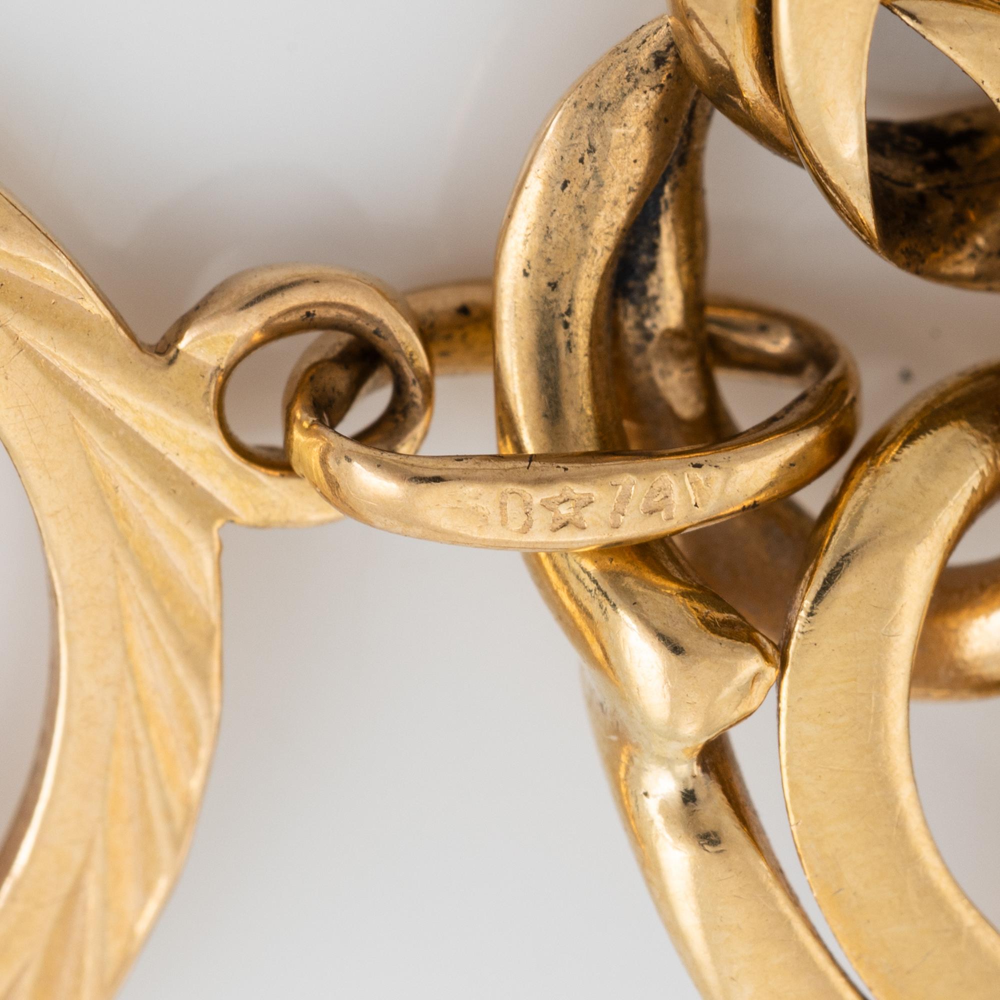 Gold charm bracelet.