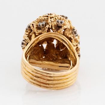 A WA Bolin ring in 18K gold set with round brilliant-cut diamonds.