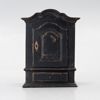 A Baroque wall cabinet, 18th Century.