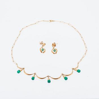 An 18K gold neckalce and a pair of earring set with green stones.