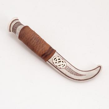 A reindeer horn knife by Isak Matti Juuso, signed and dated 2006.