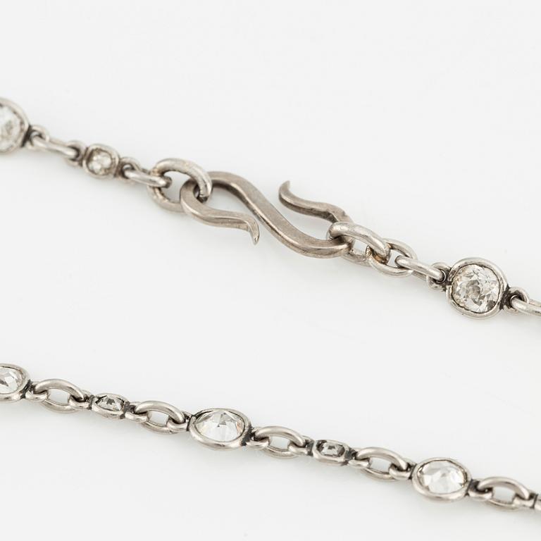 An antique platinum diamond long chain.