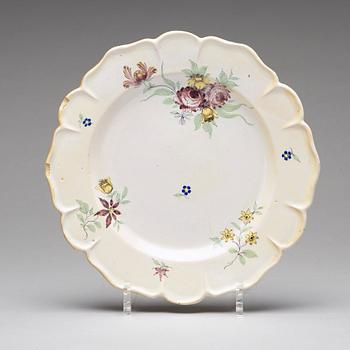 A set of six odd Swedish faience plates, Marieberg and Rörstrand, 18th Century.