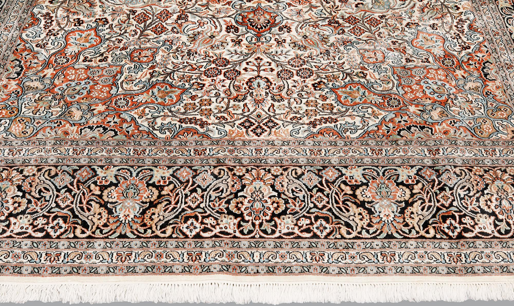 A silk Kashmir carpet, ca 330 x 246 cm.