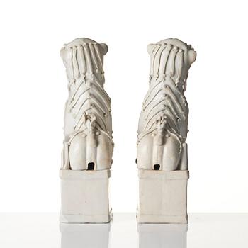 A pair of Chinese blanc de Chine 'Buddhist lion' joss stick holders, Qing dynasty, Kangxi (1662-1722).