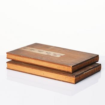 A print of the 'Remaining Ink of Ming Virtues, in a wooden case, two volumes.