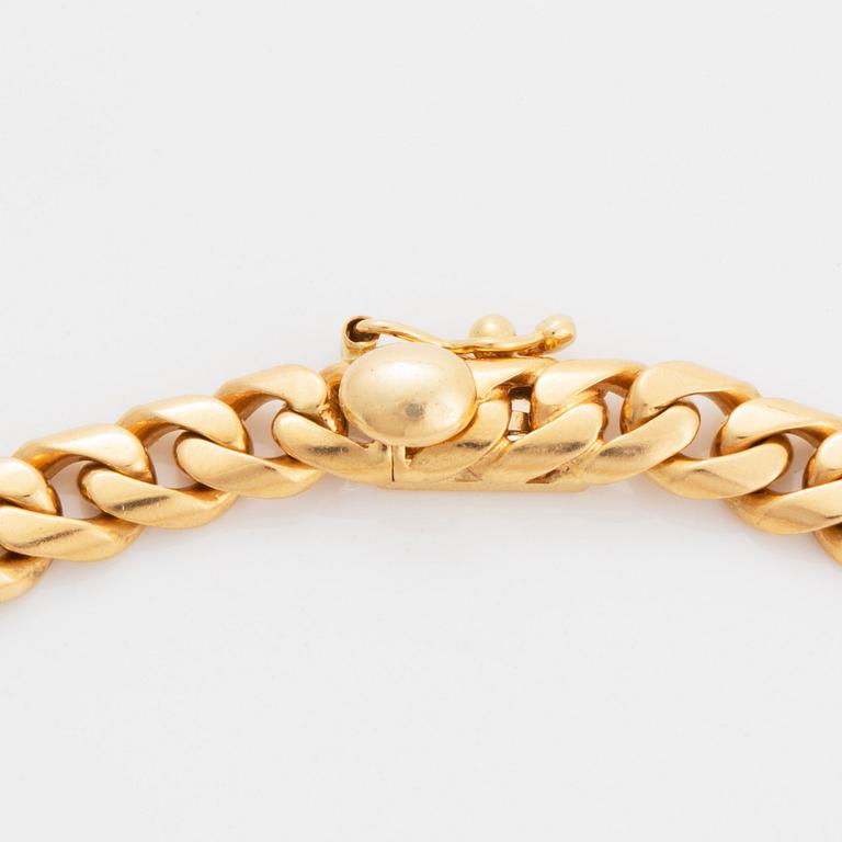 Bulgari "Monete" collier 18K guld med ett romerskt mynt och en baguetteslipad diamant.