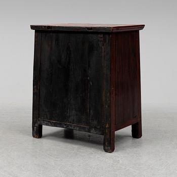A red lacqured Chinese cabinet, 20th Century.