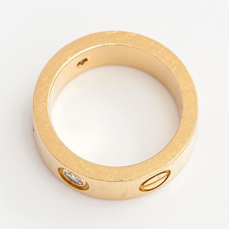 Cartier, an 18K gold 'Love' ring with three brilliant-cut diamonds.