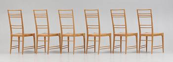 A set of six Erik Chambert 'Poem' birch and rattan dining chairs, Chambert's, Norrköping, Sweden, probably 1950's.