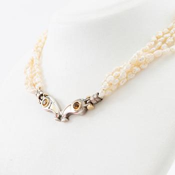 Tonino Lamborghini, Necklace of cultured pearls with a pendant of 18K gold, silver, and faceted citrines.