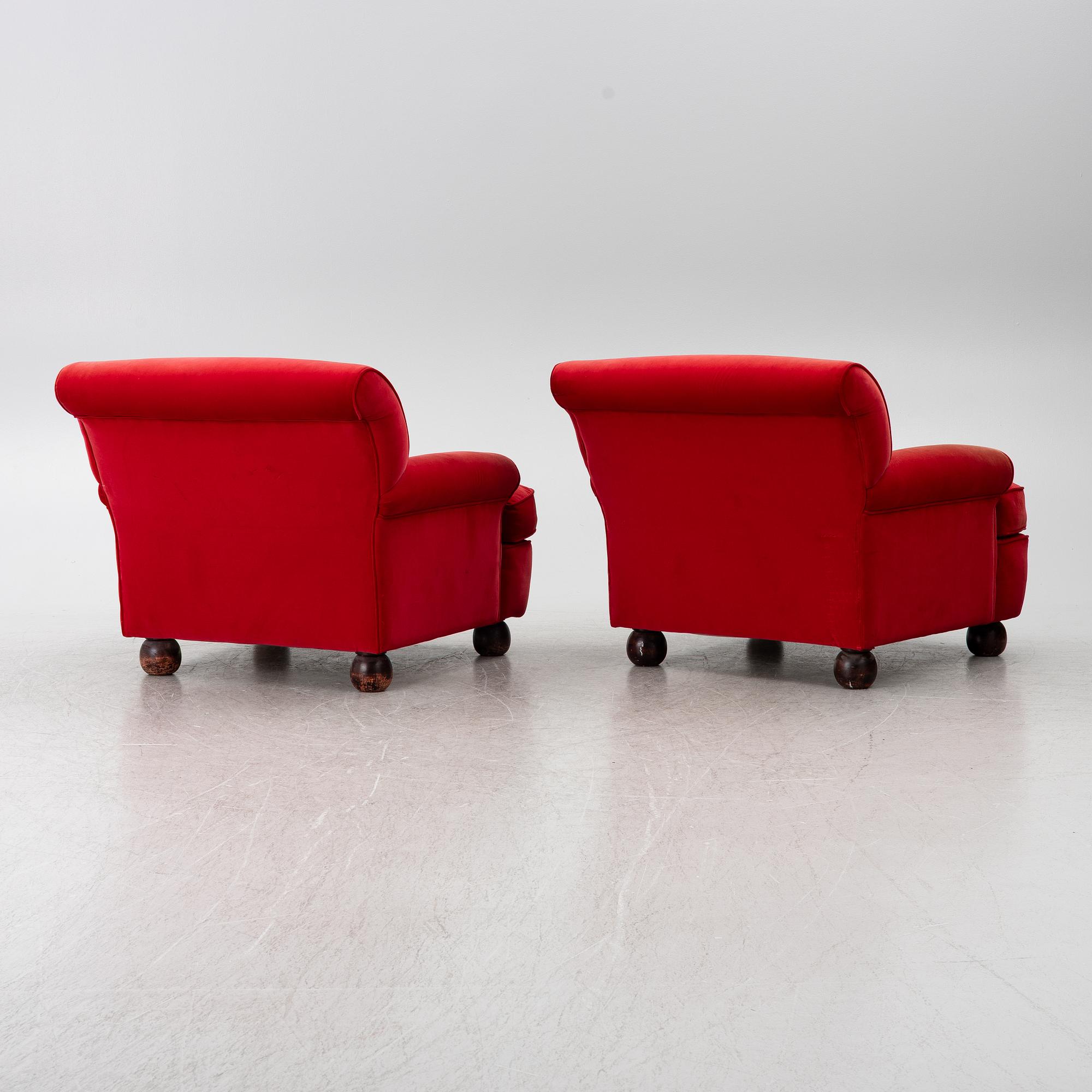 A pair of Howard-style armchairs and a footstool, late 20th century.