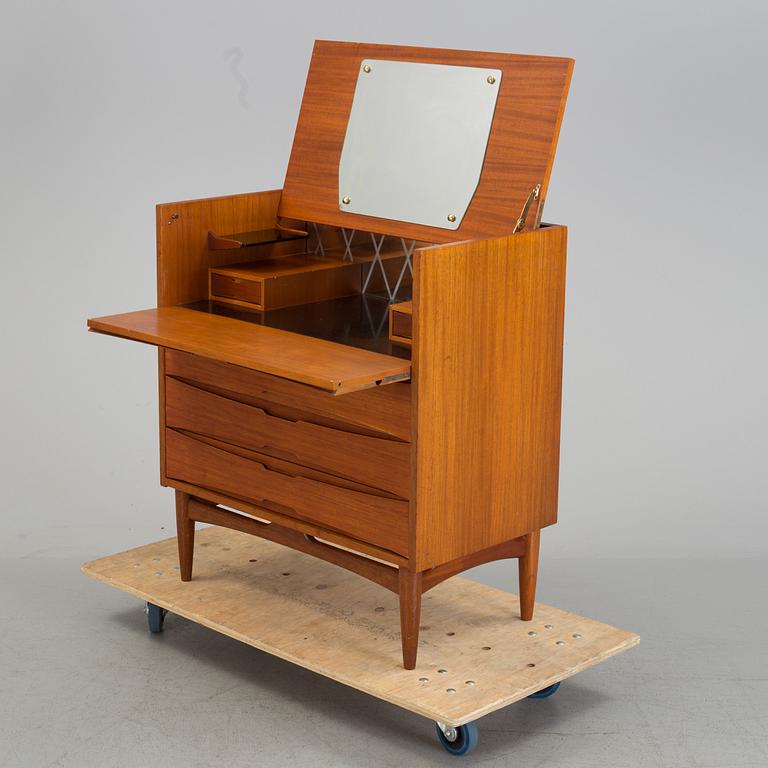 A mid 20th century teak dressing commode.