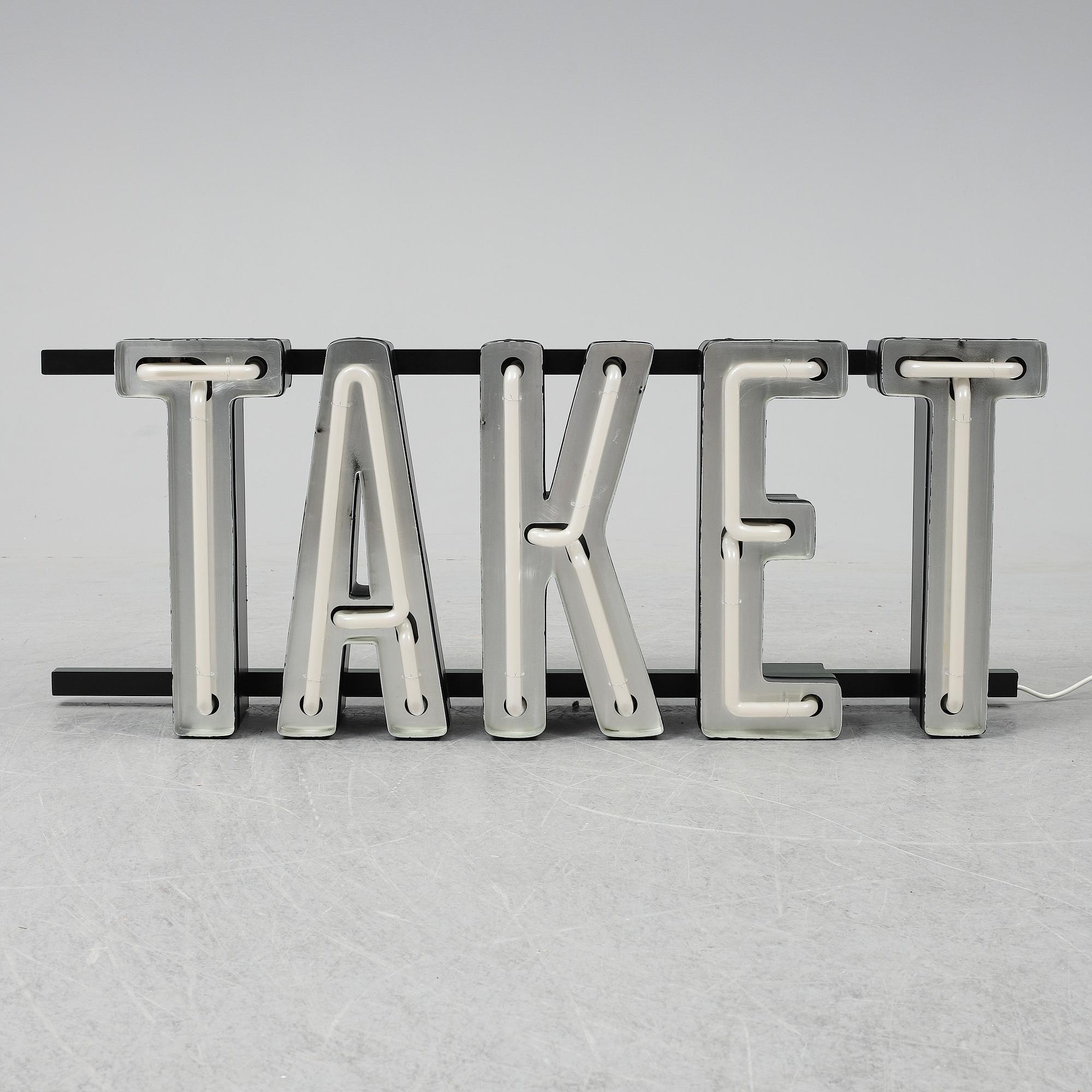 A neon sign "TAKET", late 20th century/21st century.