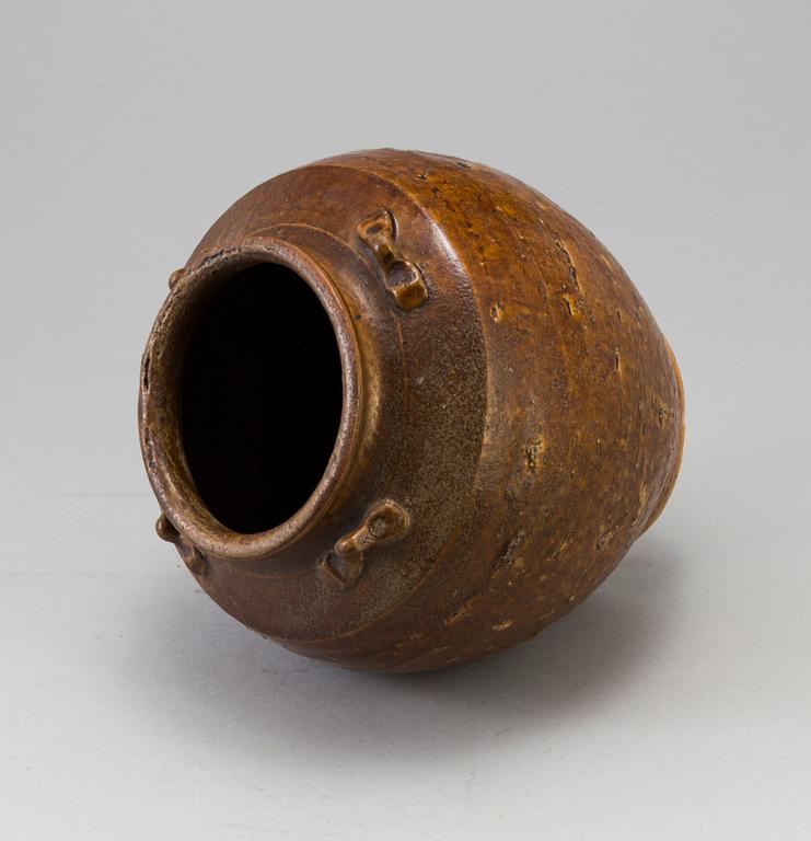 A south east asian pottery urn 18/19th century.