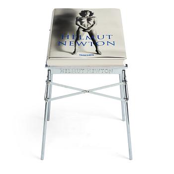 Helmut Newton, Signed book published by Taschen, Monte Carlo, 1999, ed 10000, with a metal table.