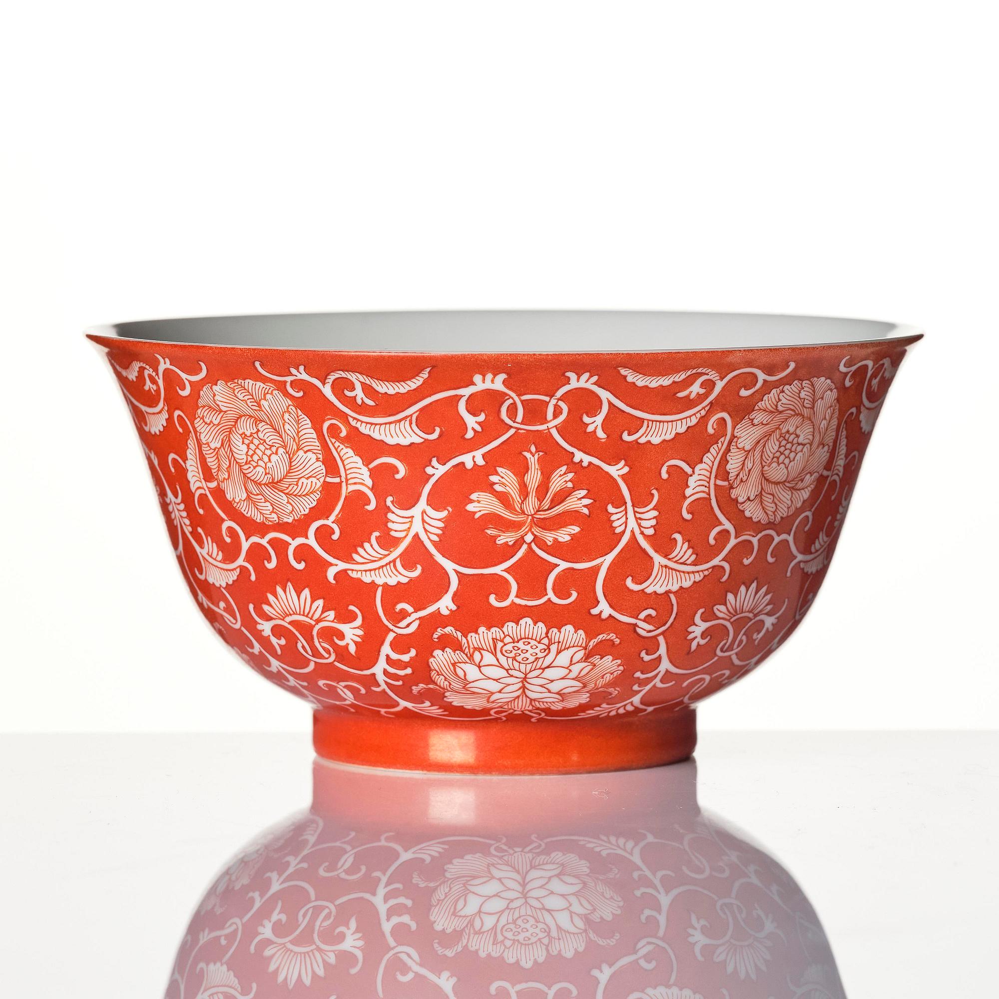 A coral red reserve decorated floral bowl, Qing dynasty with Qianlong mark.