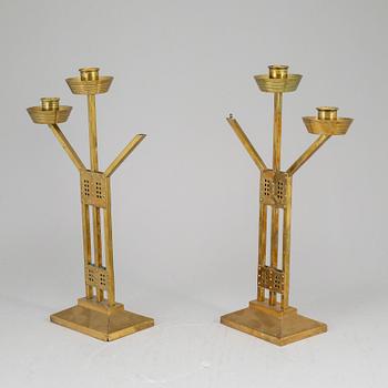 A pair of Art nouveau brass candelabra, early 20th Century.