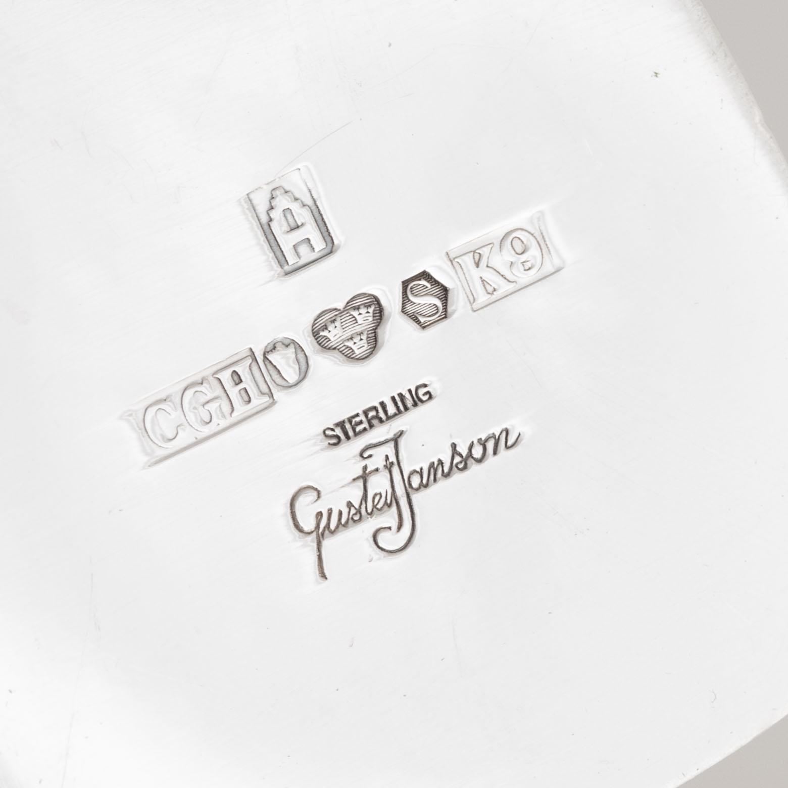 A silver candlestick, a beaker and a vase, including Gustaf Janson, CG Hallberg, Stockholm 1960.