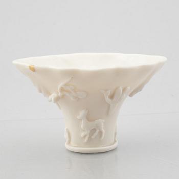 A blanc de chine rhinoceros libation cup, Qing dynasty, Kangxi (1662-1722).