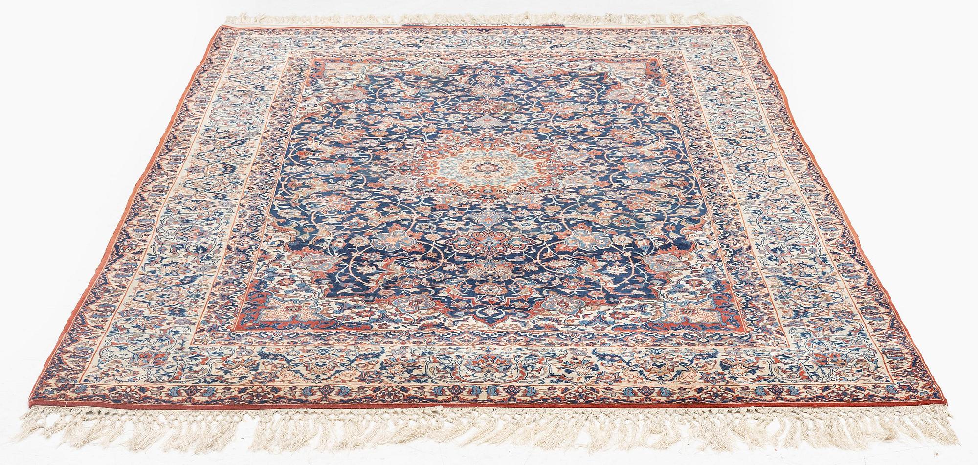 A semi-antique Isfahan rug, signed (Sadegh) Seirafian, c. 244 x 149 cm.