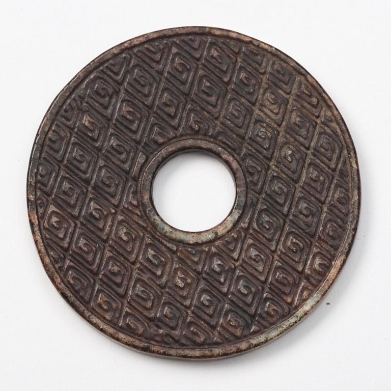 A group of three archaistic Chinese stone bi discs and two pendants.